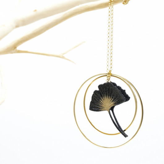 Long necklace with ginko leaf and double gold brackets